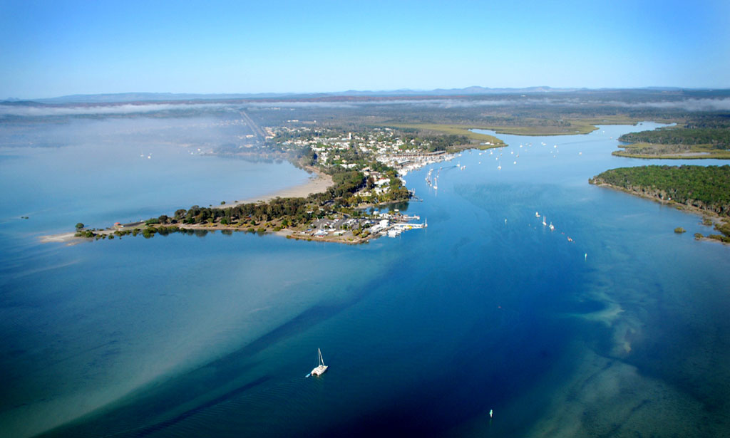 A catamaran heads into Snapper Creek at Tin Can Bay. A catamaran heads into Snapper Creek at Tin Can Bay.