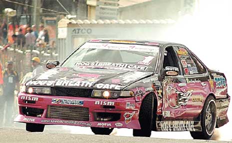 Dan Kenneally from Brisbane puts on a drifting show in his Nissan Cefiro. Dan Kenneally from Brisbane puts on a drifting show in his Nissan Cefiro.