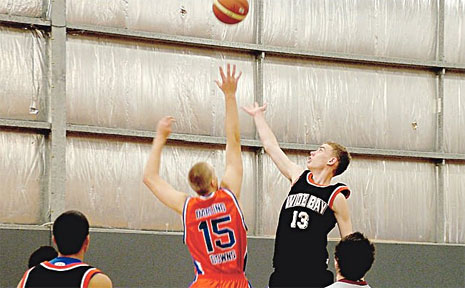 Warwick player Eugene Bradshaw leaps high at the recent Queensland Secondary School Basketball Championships at Auchenflower. Warwick player Eugene Bradshaw leaps high at the recent Queensland Secondary School Basketball Championships at Auchenflower.