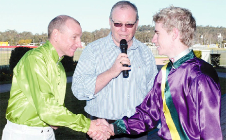 MASTER AND APPRENTICE: Ipswich Turf Club race caller Wayne Wilson (middle) adds his congratulations as veteran jockey Shane Scriven (left) shakes hands with boom apprentice Brent Evans at Friday's exciting premiership battle. MASTER AND APPRENTICE: Ipswich Turf Club race caller Wayne Wilson (middle) adds his congratulations as veteran jockey Shane Scriven (left) shakes hands with boom apprentice Brent Evans at Friday's exciting premiership battle.