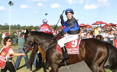 BACK IN STRIDE: Jockey Matthew Paget jumps aboard Miz Winfrey and pumps his whip in the air for the fifth event on the Ballina race card, less than 30 minutes after jockeys voted to continue with the Ballina Cup program. BACK IN STRIDE: Jockey Matthew Paget jumps aboard Miz Winfrey and pumps his whip in the air for the fifth event on the Ballina race card, less than 30 minutes after jockeys voted to continue with the Ballina Cup program.