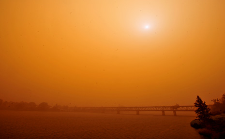 Dust haze makes the Grafton Bridge almost invisible from the deck of the South Grafton Bowling Club as an orange glow covers the Clarence Valley. Dust haze makes the Grafton Bridge almost invisible from the deck of the South Grafton Bowling Club as an orange glow covers the Clarence Valley.