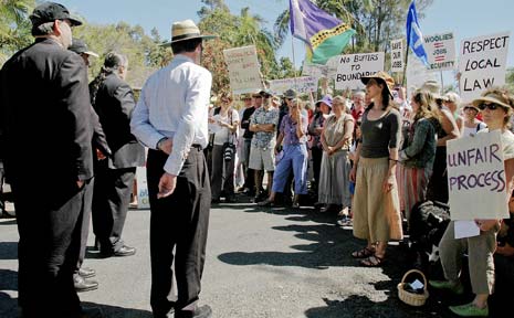 Protesters for and against the Mullumbimby Woolworths development during a Land and Environment Court on-site inspection. ‘Save our jobs’ signs clashed with anti-Woolies slogans such as ‘Woolworths, I won’t shop there’. Protesters for and against the Mullumbimby Woolworths development during a Land and Environment Court on-site inspection. ‘Save our jobs’ signs clashed with anti-Woolies slogans such as ‘Woolworths, I won’t shop there’.