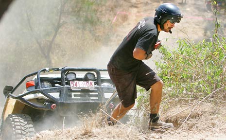 UP WE GO: Navigator Mick Upham does the leg work with the winch wire for driver Brad Dukes during the final stages of last week’s 2009 EFS XI competition at Seeone Park. UP WE GO: Navigator Mick Upham does the leg work with the winch wire for driver Brad Dukes during the final stages of last week’s 2009 EFS XI competition at Seeone Park.