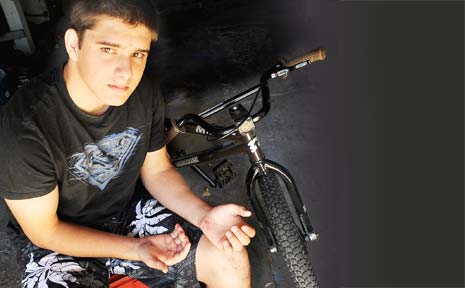 CLOSE CALL: Pictured at his East Lismore home yesterday still recovering from the bike accident is Kurtis Rose, 16, with his mother Tina. CLOSE CALL: Pictured at his East Lismore home yesterday still recovering from the bike accident is Kurtis Rose, 16, with his mother Tina.