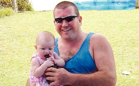 Kingscliff firefighter Andrew Turnbull with his youngest daughter Kiara. Kingscliff firefighter Andrew Turnbull with his youngest daughter Kiara.