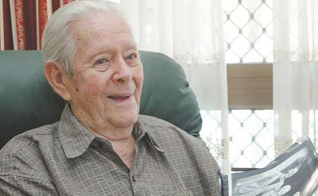 Max Lovelock looks back in time with a photograph of himself as a young man when he worked as a telephone switchboard operator. Max Lovelock looks back in time with a photograph of himself as a young man when he worked as a telephone switchboard operator.