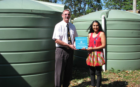 School principal Tim Edwards and school parent and grant driver Bev Dhnaram are pictured with the two water tanks. School principal Tim Edwards and school parent and grant driver Bev Dhnaram are pictured with the two water tanks.