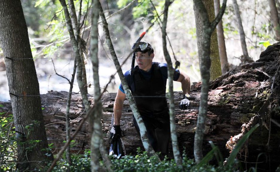 A police diver heads for the water during a massive police and SES search at Dairyville west of Coffs Harbour following the discovery of a man's torso in a creek. A police diver heads for the water during a massive police and SES search at Dairyville west of Coffs Harbour following the discovery of a man's torso in a creek.