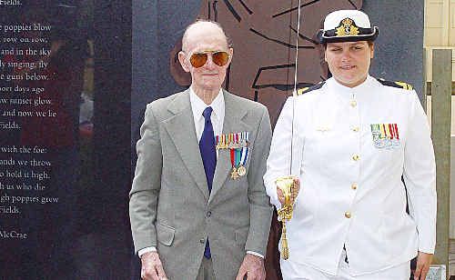 Former Childers resident and veteran Wally Williams, who never misses an Anzac Day or Remembrance Day service, is seen with Lieutenant Alicia Runde at the Isis War Memorial Precinct. Former Childers resident and veteran Wally Williams, who never misses an Anzac Day or Remembrance Day service, is seen with Lieutenant Alicia Runde at the Isis War Memorial Precinct.