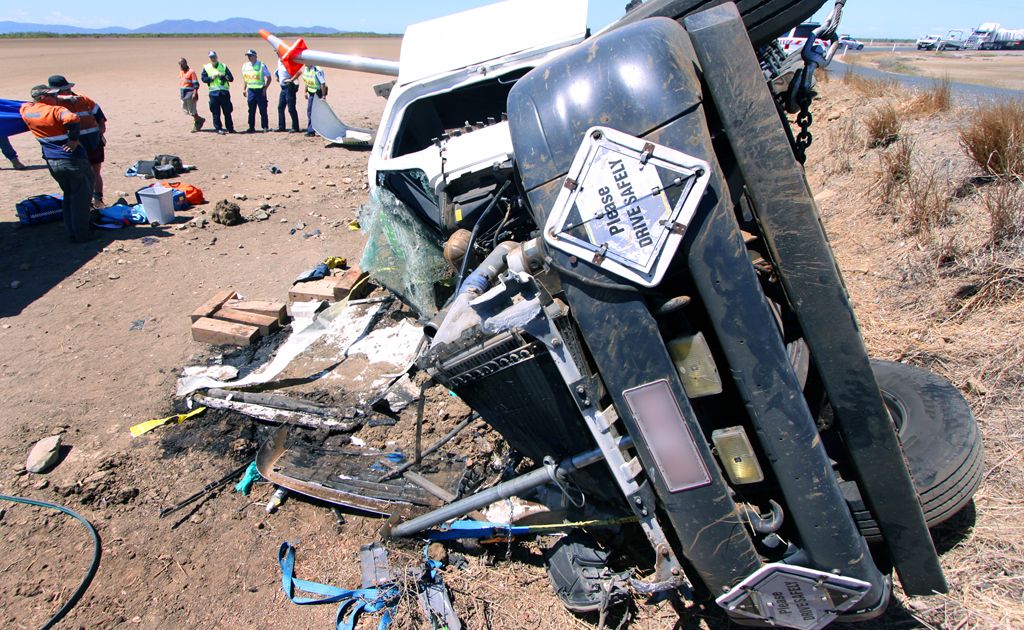 A truck driver was trapped for 3 hours when his rig rolled while trying to take a corner on the Port Alma Road. CHRIS ISON CI12/1109/5 A truck driver was trapped for 3 hours when his rig rolled while trying to take a corner on the Port Alma Road. CHRIS ISON CI12/1109/5