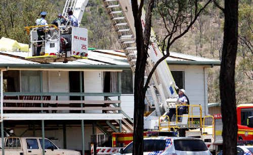 Emergency services retrieve the body of a 16-year-old boy killed at a Stanwell house, west of Rockhampton. Emergency services retrieve the body of a 16-year-old boy killed at a Stanwell house, west of Rockhampton.