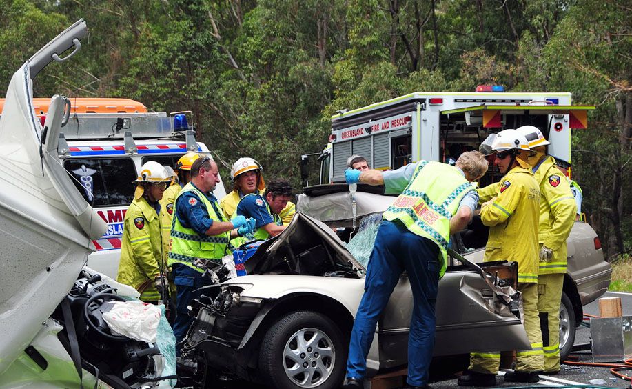 Emergency Services workers try unsuccessfully to save a driver involved in a collision on Tewantin Cooroy Road, down from Sunrise Road.
Emergency Services workers try unsuccessfully to save a driver involved in a collision on Tewantin Cooroy Road, down from Sunrise Road.