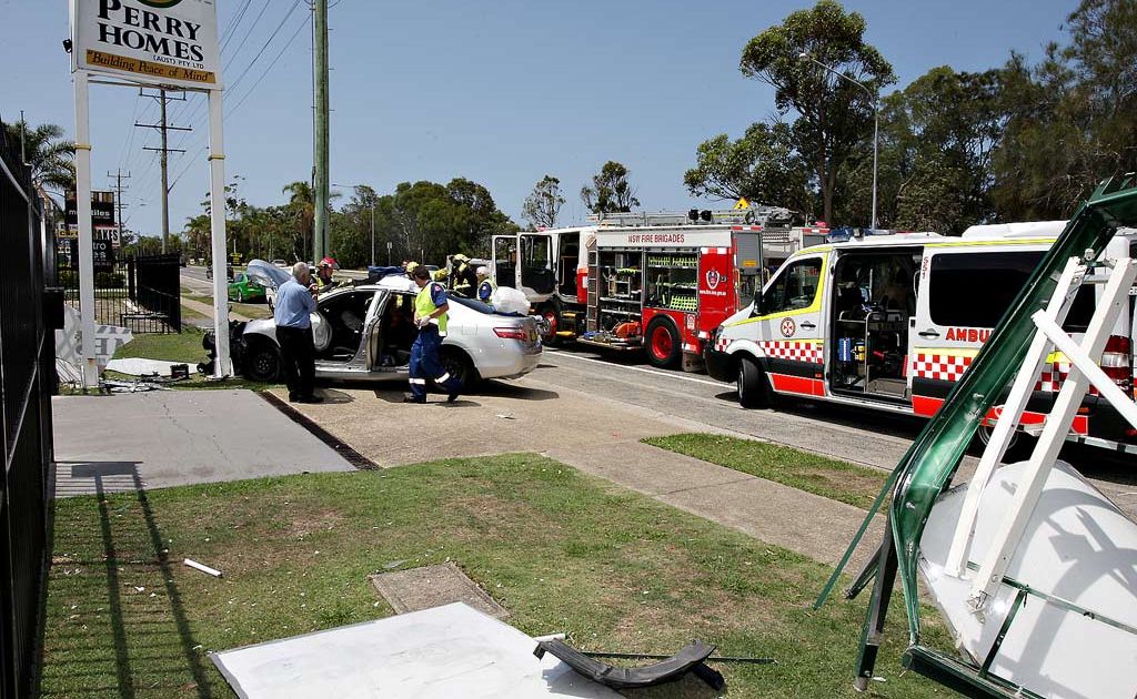 Emergency service crews work to free an elderly Tweed Heads woman from her car. Emergency service crews work to free an elderly Tweed Heads woman from her car.