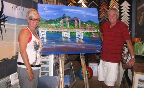 COOLANGATTA artist Shelena Russell and former Murwillumbah lad Warren Thomson with the painting of the old Murwillubmah bridge. Photo: Supplied COOLANGATTA artist Shelena Russell and former Murwillumbah lad Warren Thomson with the painting of the old Murwillubmah bridge. Photo: Supplied