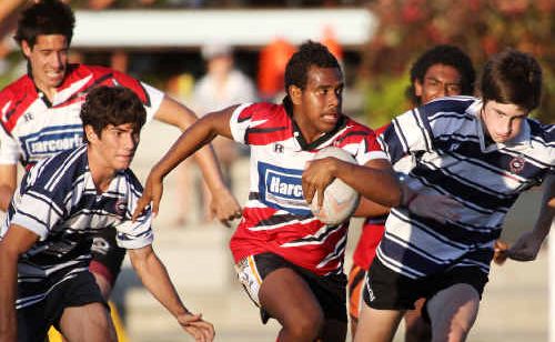 Colts’ Riley Baira makes a break up the middle in the under-14 rugby final against Brothers. Colts’ Riley Baira makes a break up the middle in the under-14 rugby final against Brothers.