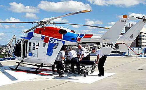 The injured man is placed in the AGL Rescue Helicopter to be taken to Royal Brisbane Hospital. The injured man is placed in the AGL Rescue Helicopter to be taken to Royal Brisbane Hospital.