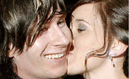 Nikki Scofield plants a kiss on the cheek of her boyfriend Nick Daley after accepting his wedding proposal outside the Lismore Workers Club on the evening of Nikki’s school formal. Nikki Scofield plants a kiss on the cheek of her boyfriend Nick Daley after accepting his wedding proposal outside the Lismore Workers Club on the evening of Nikki’s school formal.