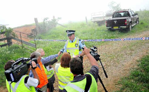 Inspector Darren Williams prevents the media getting close to the crash site at Dorrigo Mountain yesterday. Inspector Darren Williams prevents the media getting close to the crash site at Dorrigo Mountain yesterday.