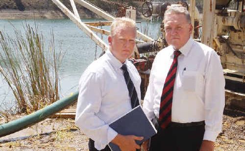 SLOW PROCESS: Detective Senior Sergeant Glen Farmer and Detective Superintendent Brian J. Wilkins at Green Lake, which is being drained in the hope of finding the body of Dulcie Birt. SLOW PROCESS: Detective Senior Sergeant Glen Farmer and Detective Superintendent Brian J. Wilkins at Green Lake, which is being drained in the hope of finding the body of Dulcie Birt.