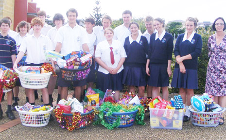 GENEROUS: Students from Xavier Catholic College with the hampers they collected for the St Vincent de Paul Society.
GENEROUS: Students from Xavier Catholic College with the hampers they collected for the St Vincent de Paul Society.