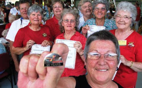 Lizzie Wratten displays her 25-year service badge in front of other Clarence Valley badge recipients. They were all recognised for their service to the Westpac Life Saver Rescue Helicopter Lizzie Wratten displays her 25-year service badge in front of other Clarence Valley badge recipients. They were all recognised for their service to the Westpac Life Saver Rescue Helicopter
