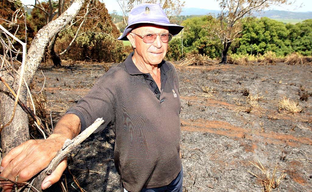 John Brinsmead at the scene of a fire which destroyed three acres, just 50 metres from his house at Duranbah. John Brinsmead at the scene of a fire which destroyed three acres, just 50 metres from his house at Duranbah.