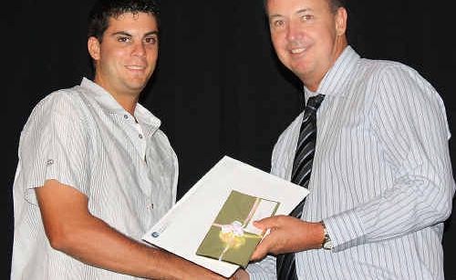Tim Grevell receives the Environment Award for Achievement in Construction, presented by Wide Bay Institute of TAFE director Trevor Schwenke. Tim Grevell receives the Environment Award for Achievement in Construction, presented by Wide Bay Institute of TAFE director Trevor Schwenke.