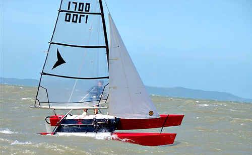 Robert Lea guides his catamaran Wild Child through a swell. Robert Lea guides his catamaran Wild Child through a swell.