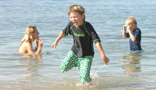 Marcus Clement, of Denmark, cools off with his family at Whiting Beach, Yamba. His father Martin said they discovered Yamba in the Lonely Planet guide en route from Cairns to Sydney. Marcus Clement, of Denmark, cools off with his family at Whiting Beach, Yamba. His father Martin said they discovered Yamba in the Lonely Planet guide en route from Cairns to Sydney.