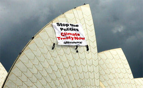 Environmental protesters, including Byron Bay activist Emma Briggs, hung a banner from the iconic Sydney Opera House on Tuesday. Environmental protesters, including Byron Bay activist Emma Briggs, hung a banner from the iconic Sydney Opera House on Tuesday.