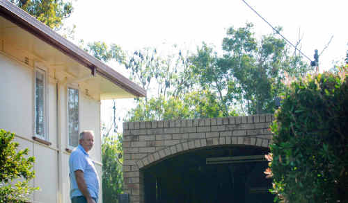 Brian Johnson outside his Harwood Street home in Maclean is blaming council for not moving the bat colony away from his home. Brian Johnson outside his Harwood Street home in Maclean is blaming council for not moving the bat colony away from his home.