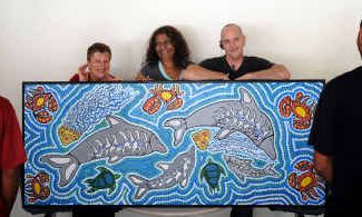 Manager of Clarence River Women’s Refuge Nav Navratil, teacher Tanya Flanders and Art Teacher at Acmena Greg with a door painted for the refuge by students at ACMENA. Manager of Clarence River Women’s Refuge Nav Navratil, teacher Tanya Flanders and Art Teacher at Acmena Greg with a door painted for the refuge by students at ACMENA.