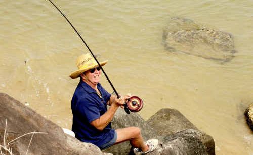 Col Howard, of Yamba, fishing on the Yamba Breakwall. Col Howard, of Yamba, fishing on the Yamba Breakwall.