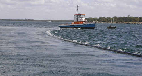 These pictures were taken from a NSW Maritime punt and show the tail-end of 1.4 kilometre of conduit that was towed across the Clarence this week as part of the Iluka power upgrade. These pictures were taken from a NSW Maritime punt and show the tail-end of 1.4 kilometre of conduit that was towed across the Clarence this week as part of the Iluka power upgrade.