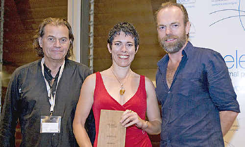 Amber Hall receives a Voiceless award from co-founder and managing director Brian Sherman (left) and Voiceless ambassador Hugo Weaving.