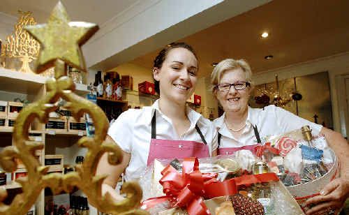 Pepper Tree Kitchen owner Helen Nott (right) and shop assistant Rebecca Osborne with some of the gourmet Christmas hampers proving very popular with shoppers in the Magellan Street store. Pepper Tree Kitchen owner Helen Nott (right) and shop assistant Rebecca Osborne with some of the gourmet Christmas hampers proving very popular with shoppers in the Magellan Street store.