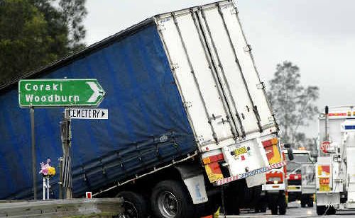 This semi-trailer skidded off the Bruxner Highway at its intersection with Coraki Road in wet conditions near Lismore. This semi-trailer skidded off the Bruxner Highway at its intersection with Coraki Road in wet conditions near Lismore.