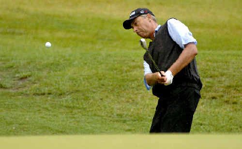 Mike Harwood chips on to a green at Byron Bay yesterday. Mike Harwood chips on to a green at Byron Bay yesterday.