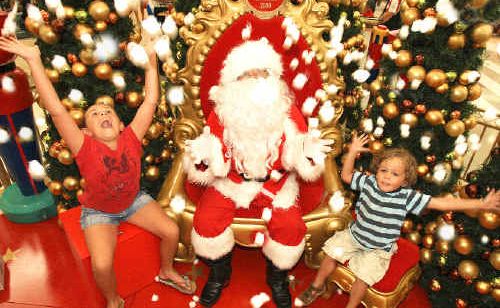 Darcy and Charlie Clarke chilling out with Santa at Tweed City Shopping Centre yesterday. Darcy and Charlie Clarke chilling out with Santa at Tweed City Shopping Centre yesterday.