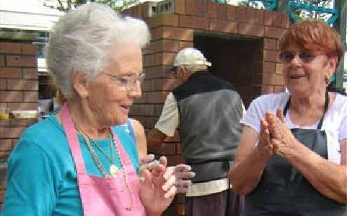 Volunteers prepare the food at last year’s Lunch with Friends. Volunteers prepare the food at last year’s Lunch with Friends.