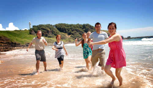 Norwegian exchange student Ingrid Johansen, right, makes a splash at Yamba’s Main Beach yesterday with her visiting family from left, Einar, Aasne, Kristina, Judith and Judith’s boyfriend, Baard. Norwegian exchange student Ingrid Johansen, right, makes a splash at Yamba’s Main Beach yesterday with her visiting family from left, Einar, Aasne, Kristina, Judith and Judith’s boyfriend, Baard.
