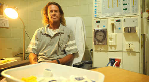Brooms Head man Jason Sheehan with his new kidney dialysis machine at home. Brooms Head man Jason Sheehan with his new kidney dialysis machine at home.