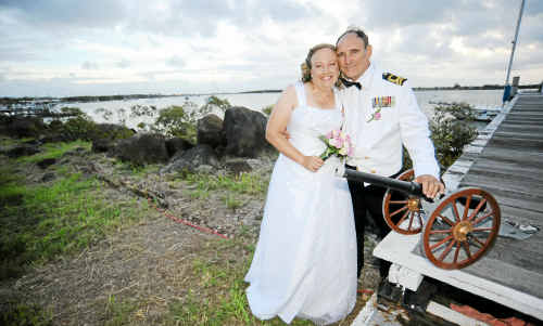 Bride and groom Kerry and Reg Rayner with a replica of the cannon. Bride and groom Kerry and Reg Rayner with a replica of the cannon.