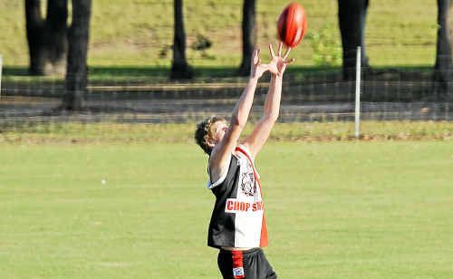 Brothers Bulldogs player Jake Goldsmith takes a great mark in open space. Brothers Bulldogs player Jake Goldsmith takes a great mark in open space.