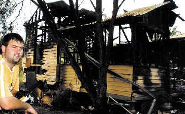Kyogle man Jason Newman was one of the first to arrive at the burning house, but could only help protect a neighbouring residence as flames quickly engulfed the old weatherboard building. Kyogle man Jason Newman was one of the first to arrive at the burning house, but could only help protect a neighbouring residence as flames quickly engulfed the old weatherboard building.