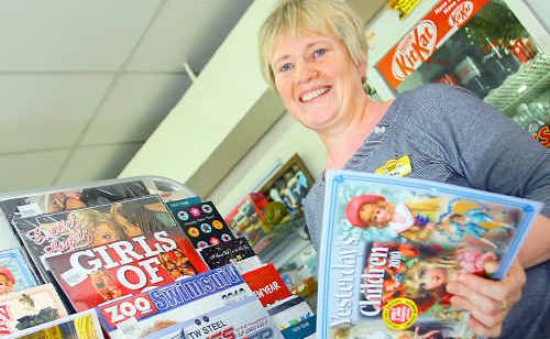 Lyndal Della-Bosca from Archer Park News chooses a calendar from the selection at her newsagency. Lyndal Della-Bosca from Archer Park News chooses a calendar from the selection at her newsagency.