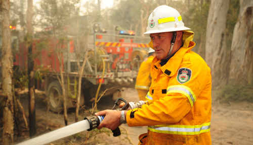 Gary Mills in action during the October bushfires. Mr Mills said he has been disappointed that his reputation has been attacked while all he has done is be of service to the community. Gary Mills in action during the October bushfires. Mr Mills said he has been disappointed that his reputation has been attacked while all he has done is be of service to the community.
