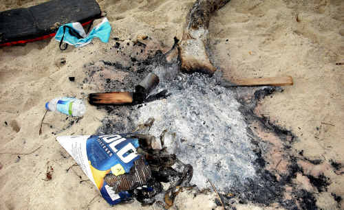 The dangerous remnants of a beach party on Yamba’s Pippi Beach last week. The dangerous remnants of a beach party on Yamba’s Pippi Beach last week.