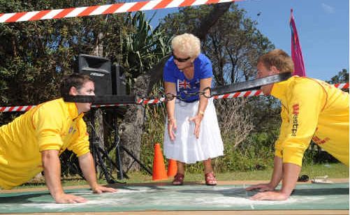 Citizen of the Year Evelyn Gane helps Ash Benfield and Anthony Holmes demonstrate goanna pulling for the crowd. Citizen of the Year Evelyn Gane helps Ash Benfield and Anthony Holmes demonstrate goanna pulling for the crowd.